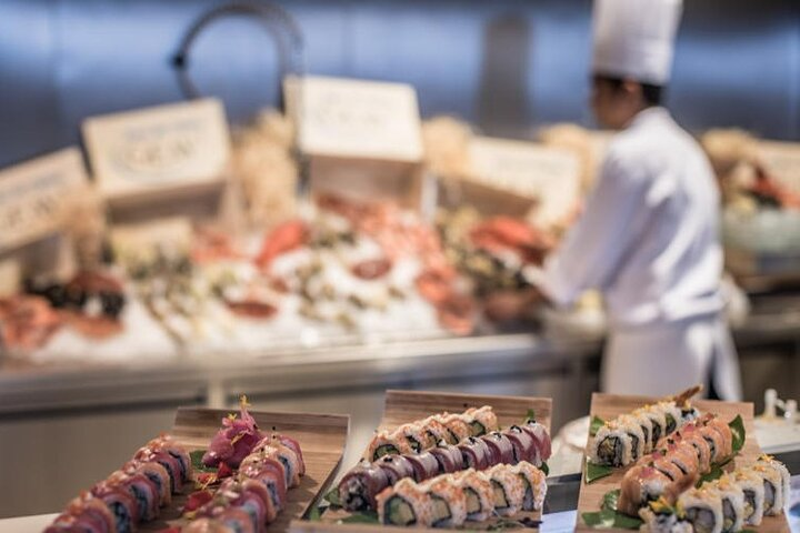 Savor exquisite seafood delicacies at Palazzo Versace Dubai where live cooking stations bring global flavors to life amidst stunning mosaic décor and a luxurious setting.
